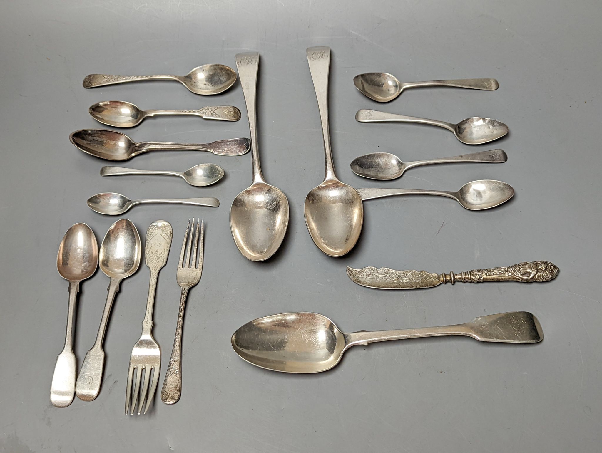 A small quantity of assorted mainly 19th century silver flatware including a pair of George III Old English pattern table spoons, Smith & Hayter, London, 1794 and a silver butter knife, 15oz